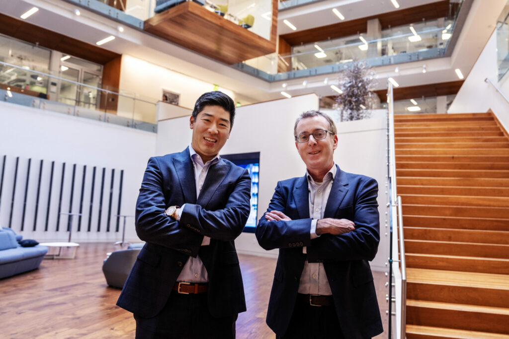 Dr. Brian S. Kim and Dr. David Artis standing in the lobby of the Allen Discovery Center, exemplifying leadership in neuroimmune research.